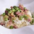 Arroz cremoso con guisantes y jamón