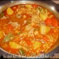 Arroz caldoso con pollo asado asado desmigado