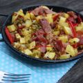 Patatas, jamón, guisantes y pimientos