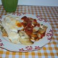 Filetes de pescado con tomate y patatas panadera
