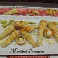 Canutillos de hojaldre, rellenos de ensaladilla.