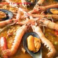 PAELLA DE ARROZ CON CARNE, VERDURA Y MARISCOS